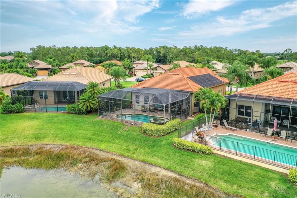 6581 Caldecott Drive Naples, FL 34113 - Photo 29 of 34 an aerial view of a house with swimming pool garden and patio