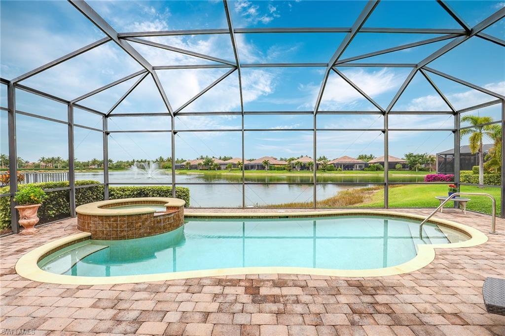6581 Caldecott Drive Naples, FL 34113 - Photo 30 of 34 a view of a swimming pool with a porch