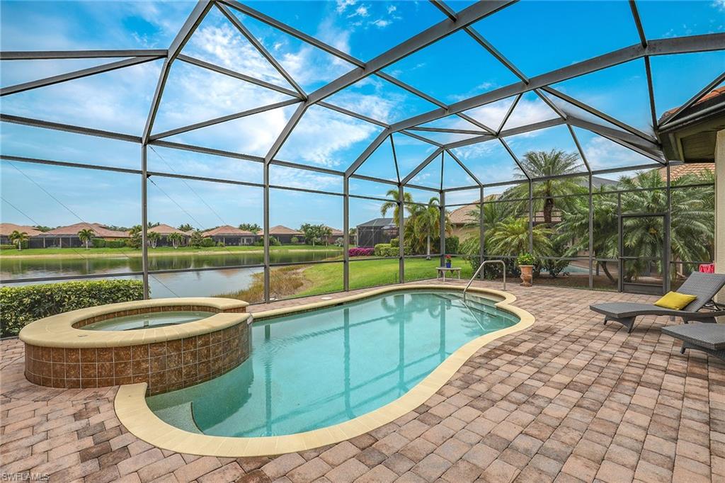 6581 Caldecott Drive Naples, FL 34113 - Photo 31 of 34 a view of a swimming pool with a patio