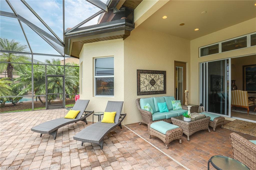 6581 Caldecott Drive Naples, FL 34113 - Photo 32 of 34 a living room with furniture and a large window