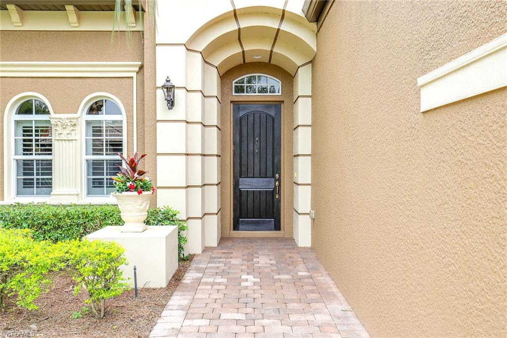 6581 Caldecott Drive Naples, FL 34113 - Photo 10 of 34 a view of a entryway door front of a house