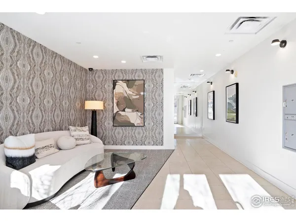 a bathroom with a glass door shower and a sink