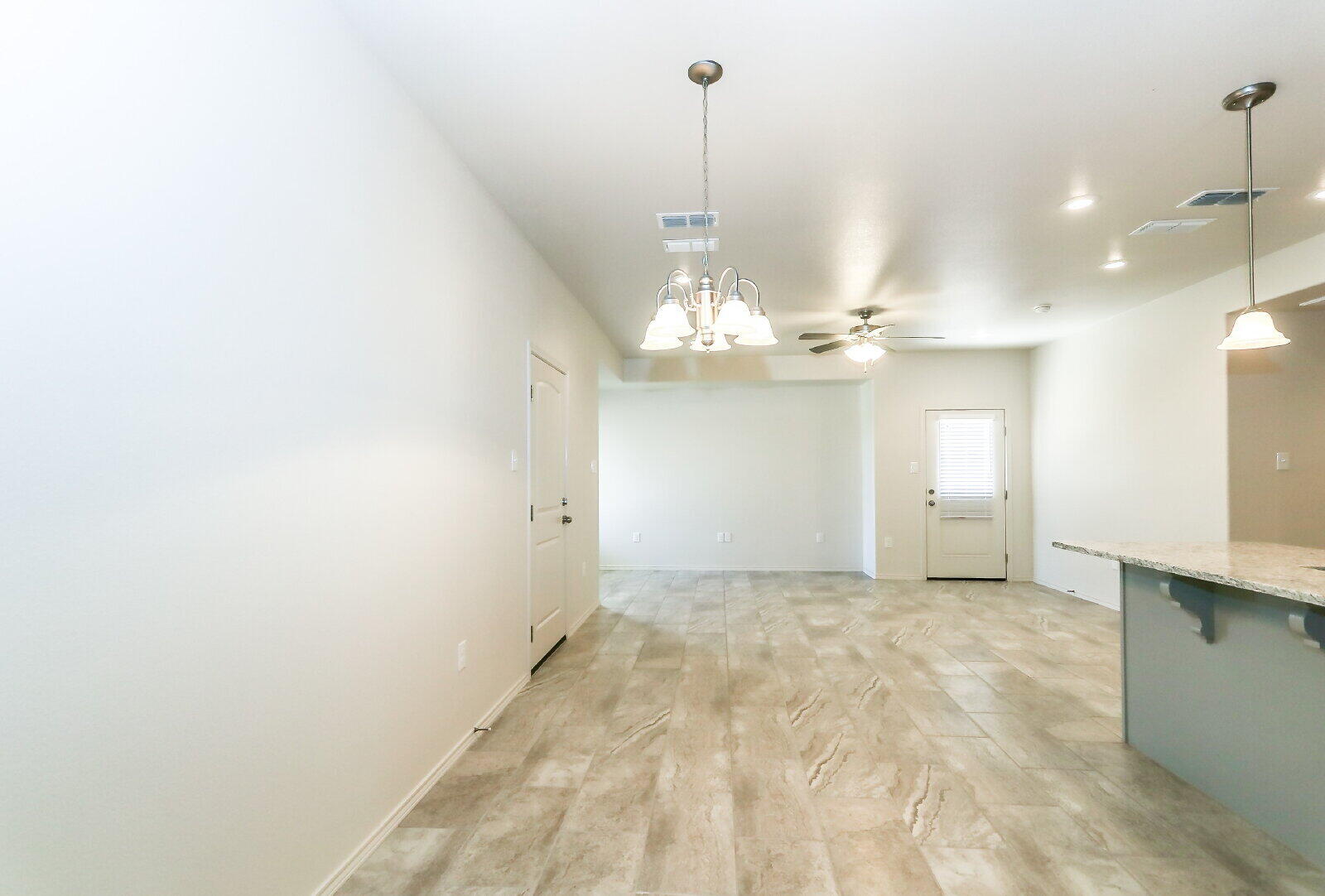 6903 67th Street, Unit A Lubbock, TX 79424 - Photo 16 of 32 a view of a chandelier in a room