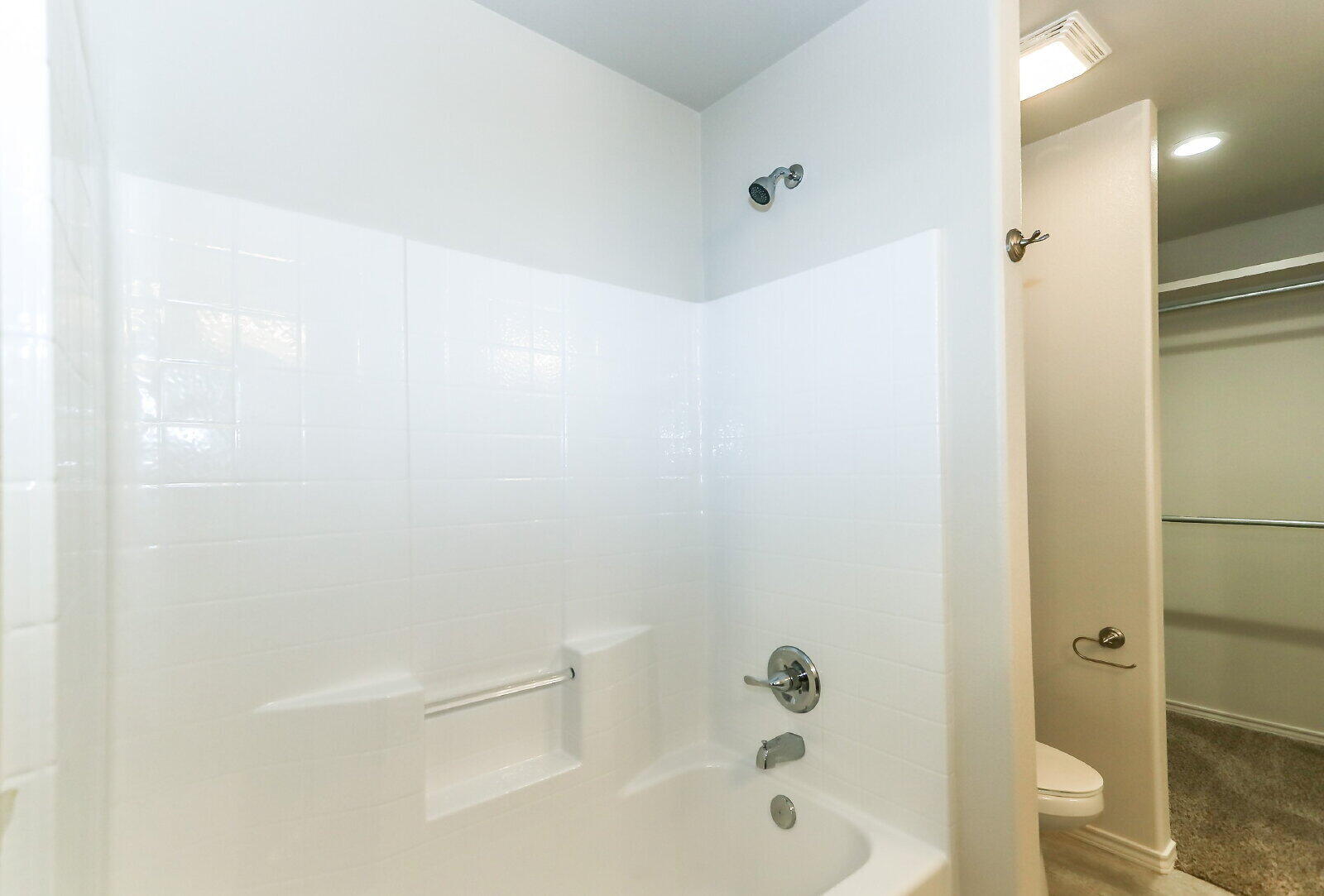 6903 67th Street, Unit A Lubbock, TX 79424 - Photo 23 of 32 a bathroom with a bathtub