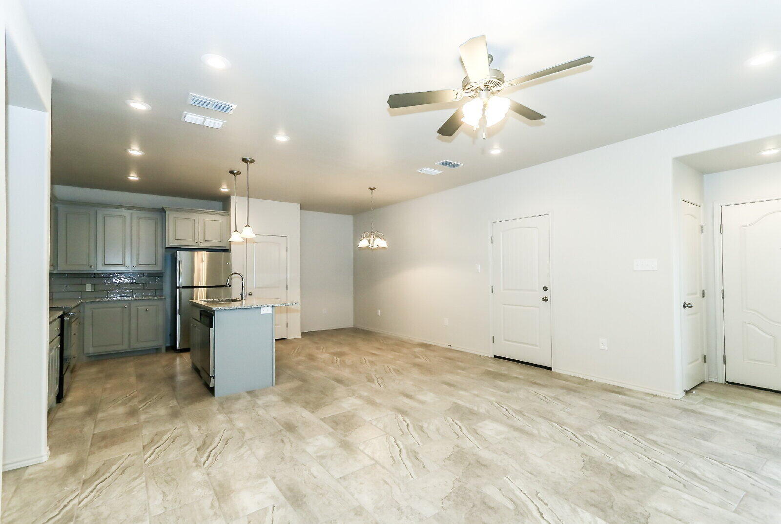 6903 67th Street, Unit A Lubbock, TX 79424 - Photo 7 of 32 a view of a kitchen with a sink and cabinet