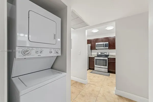 a view of washer and dryer with kitchen countertop