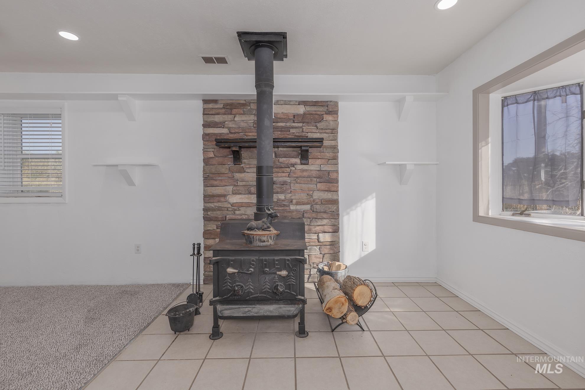 28552 Market Road Caldwell, ID 83607 - Photo 14 of 50 Detailed view of a wood stove and recessed lighting