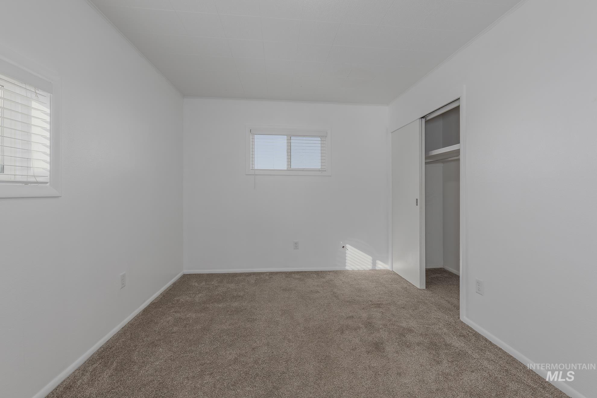 28552 Market Road Caldwell, ID 83607 - Photo 16 of 50 Unfurnished bedroom featuring a closet and carpet floors