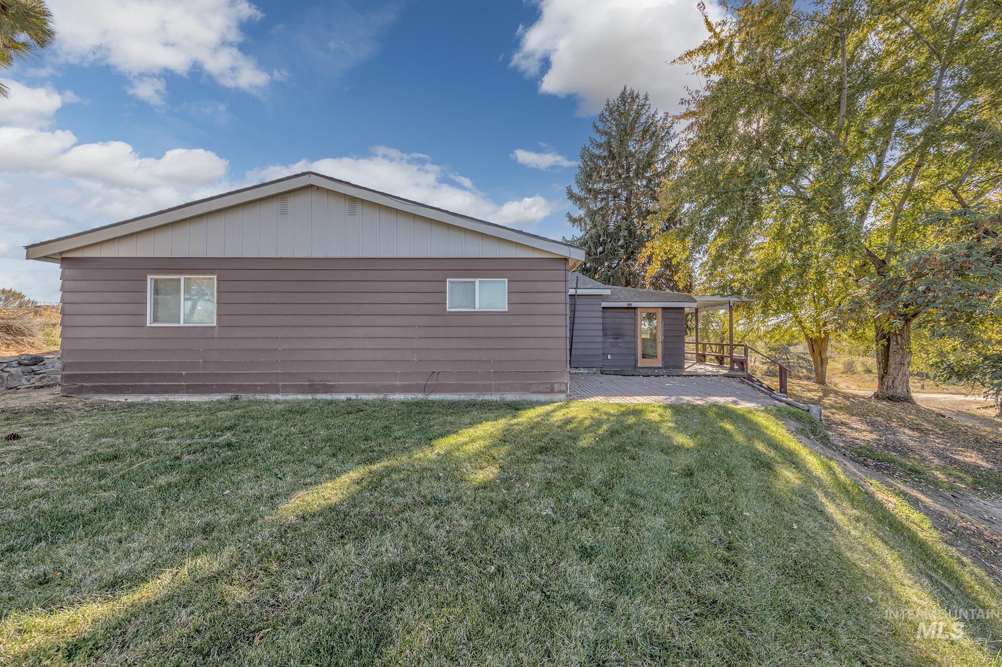 28552 Market Road Caldwell, ID 83607 - Photo 27 of 50 View of home's exterior with a lawn