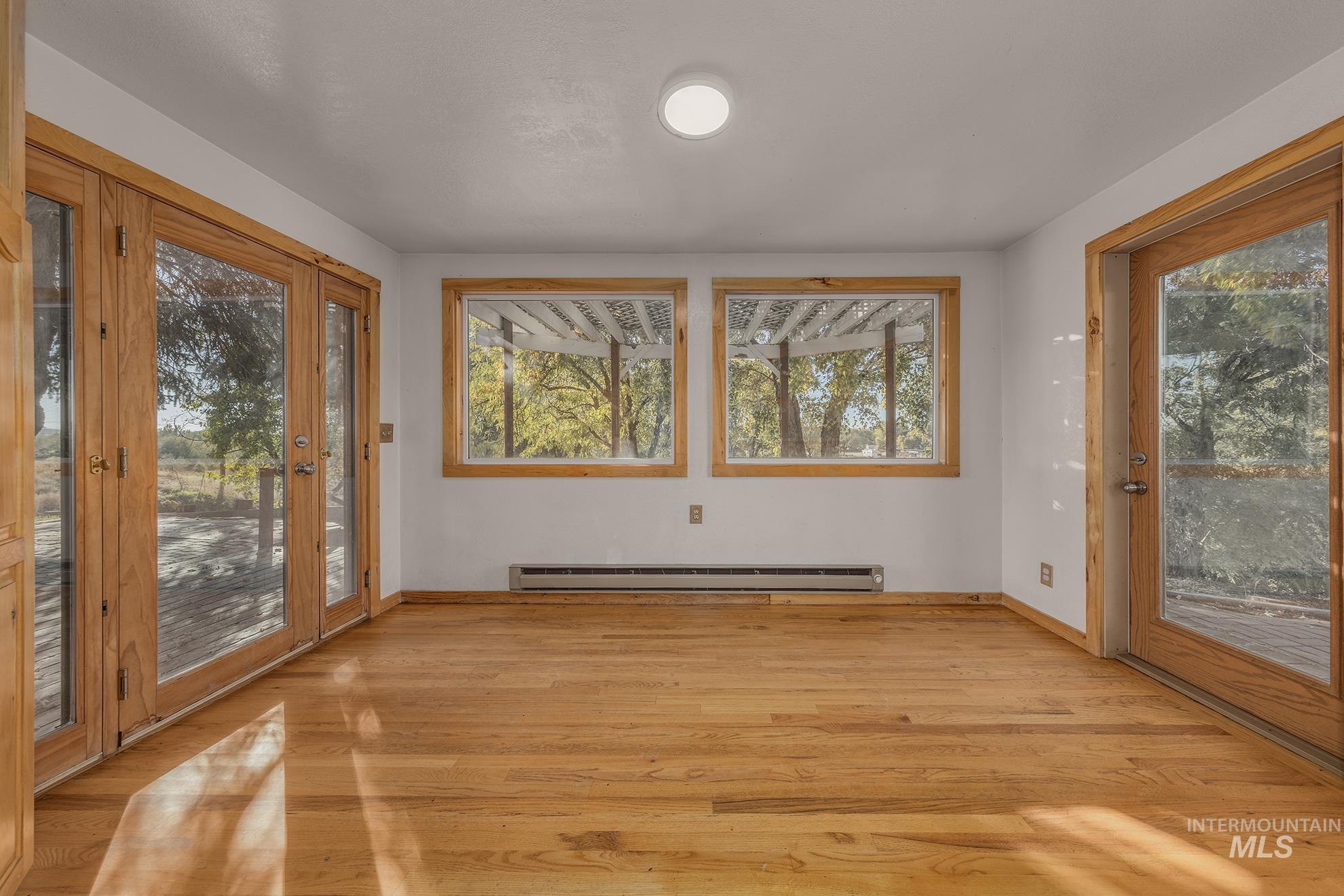 28552 Market Road Caldwell, ID 83607 - Photo 8 of 50 Unfurnished sunroom with baseboard heating