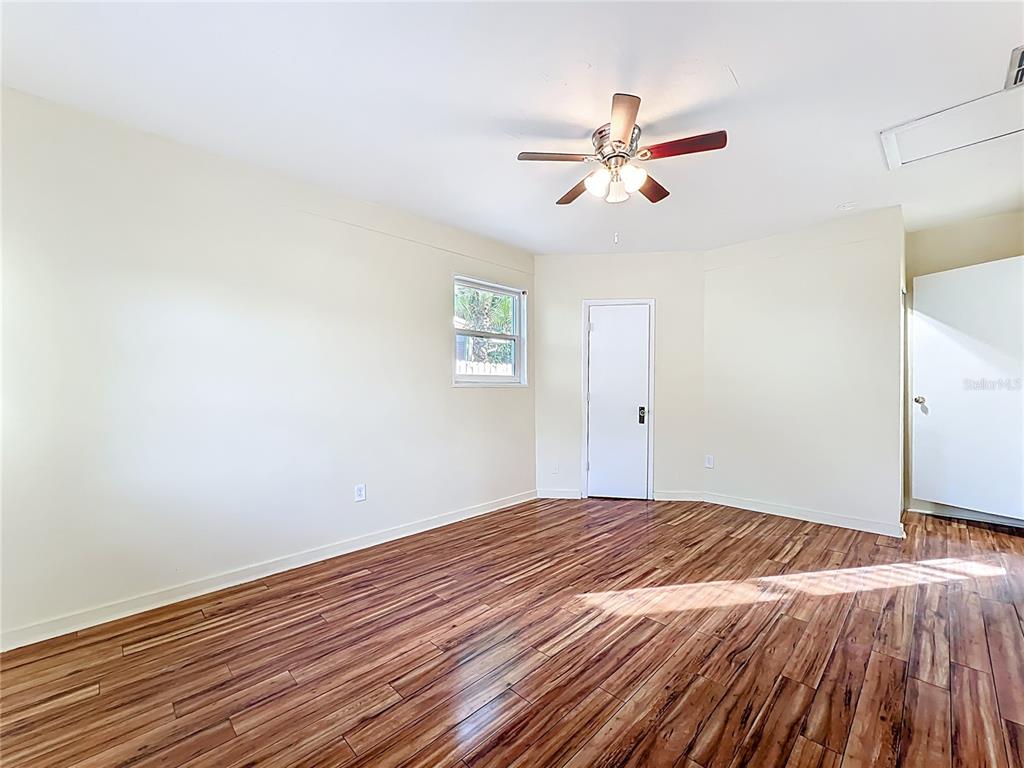12295 Ridge Road Largo, FL 33778 - Photo 13 of 31 a view of empty room with wooden floor