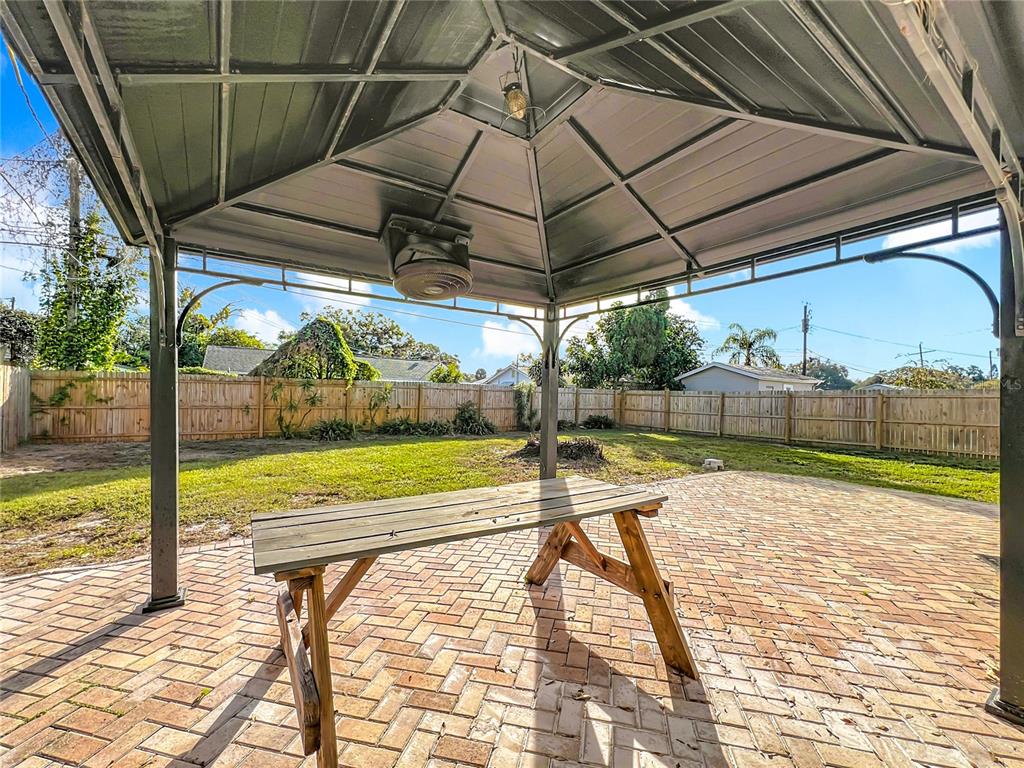 12295 Ridge Road Largo, FL 33778 - Photo 19 of 31 a view of a swimming pool with a porch