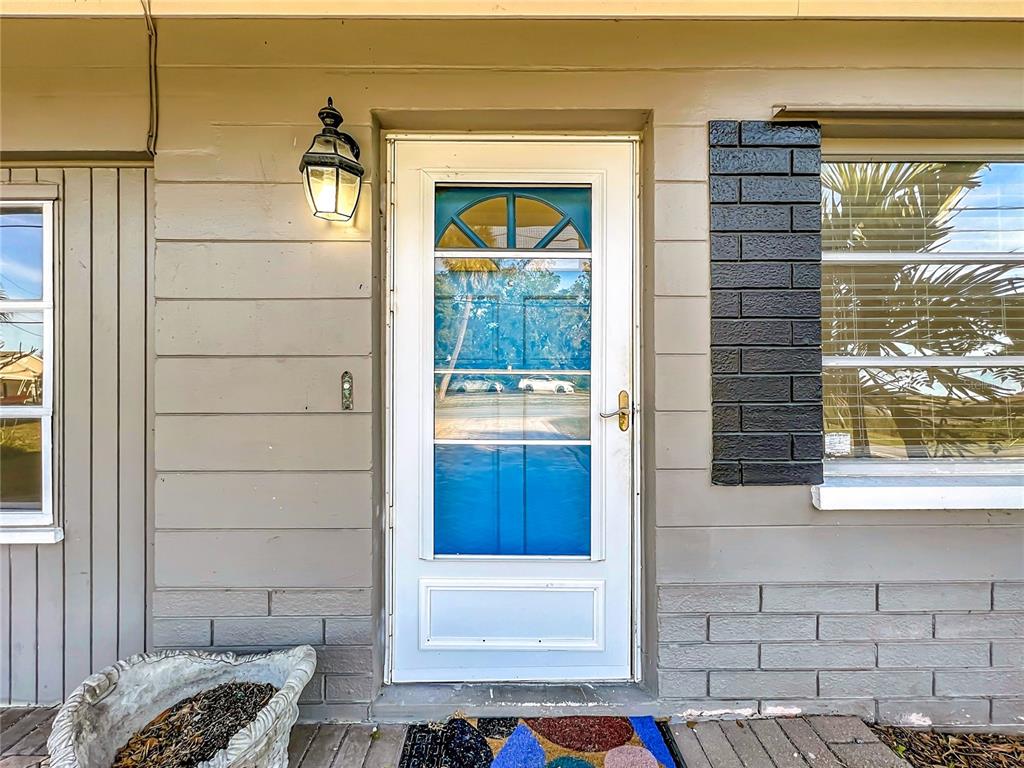 12295 Ridge Road Largo, FL 33778 - Photo 3 of 31 a view of front door and bedroom