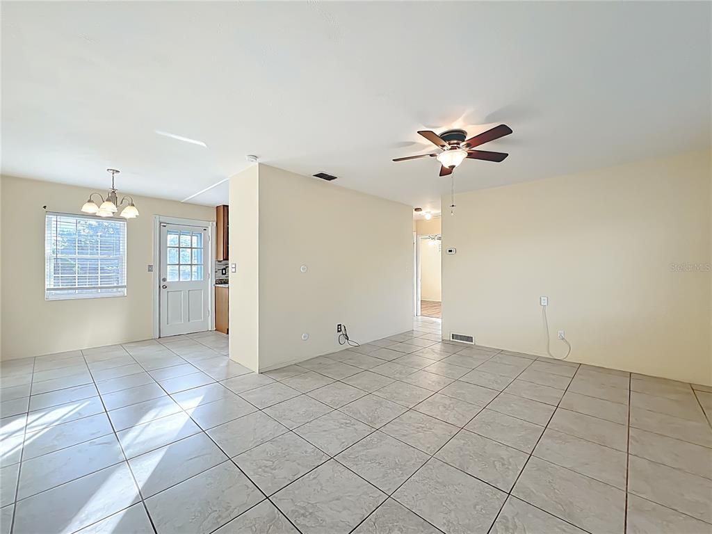 12295 Ridge Road Largo, FL 33778 - Photo 4 of 31 a view of an empty room with a ceiling fan