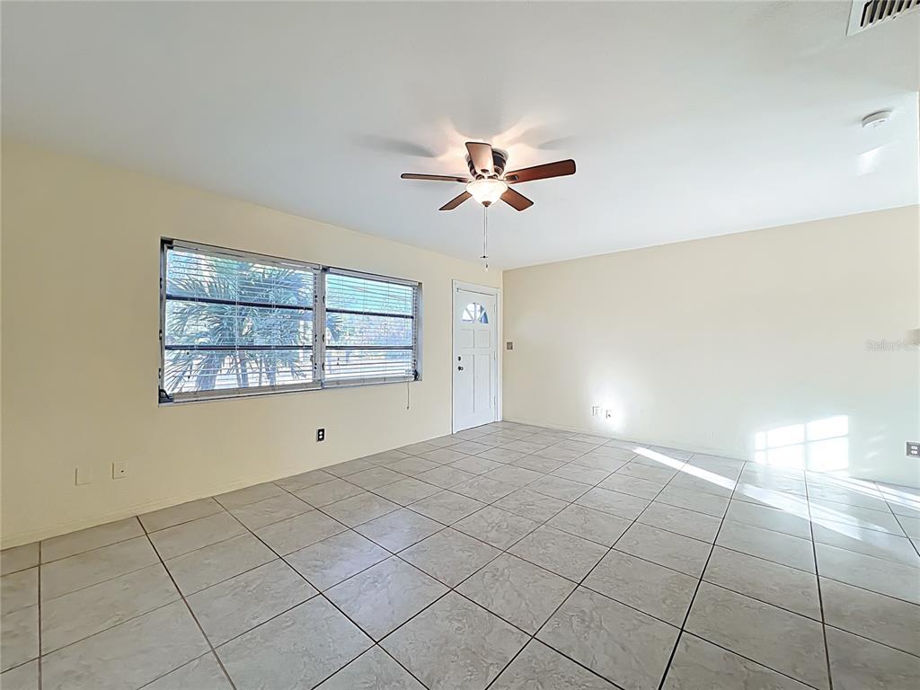 12295 Ridge Road Largo, FL 33778 - Photo 6 of 31 a view of an empty room and window