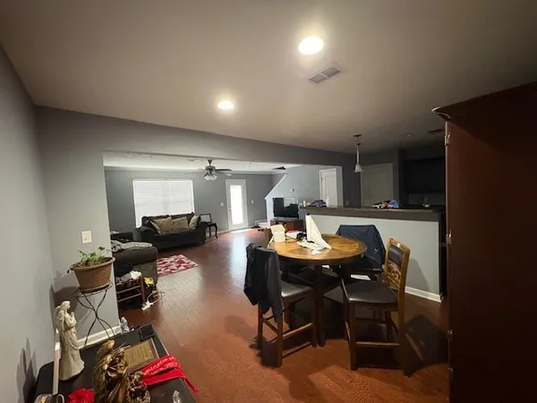 a room with furniture a rug and gym equipment