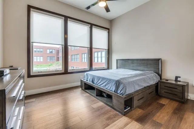a bathroom with a granite countertop sink a toilet and a mirror
