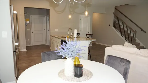 a dining room with table and chairs