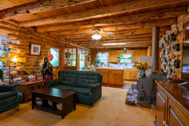 a living room with furniture and a window