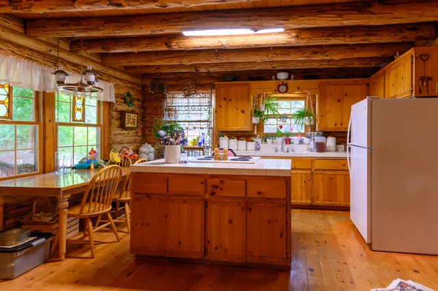 a kitchen with a sink and a refrigerator