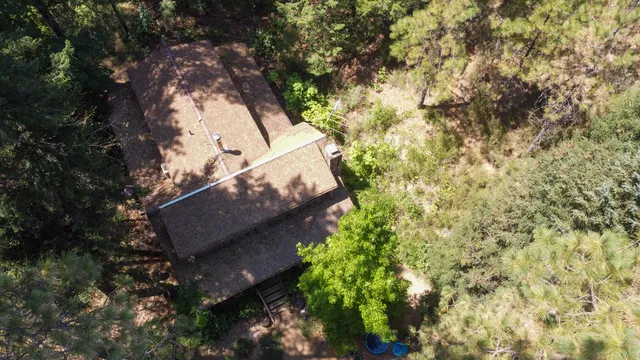 a view of a house with a tree