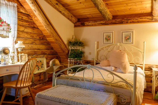 a view of a chairs and table in the balcony