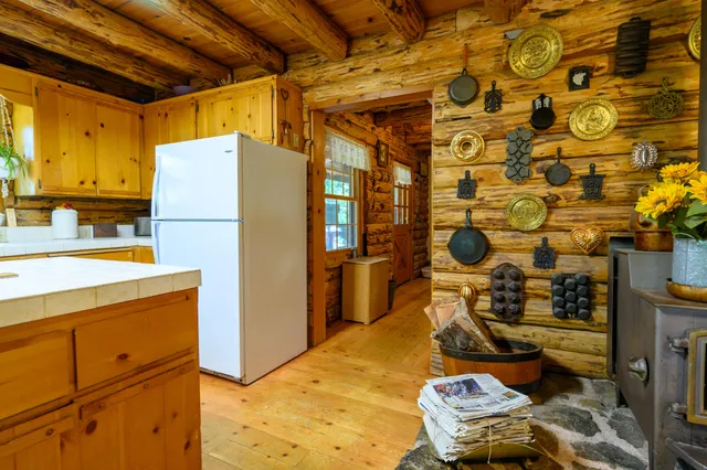 a kitchen with a refrigerator and a stove