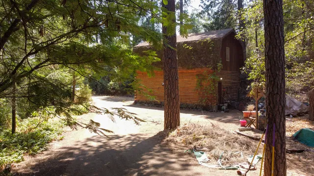 a view of a pathway of a house with a yard