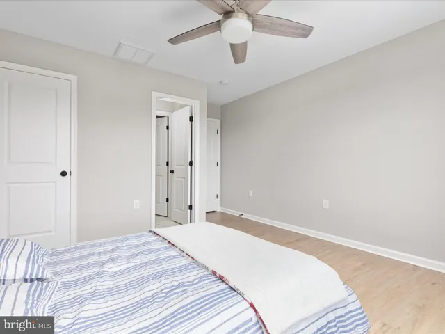 a bathroom with a granite countertop sink a mirror and a vanity