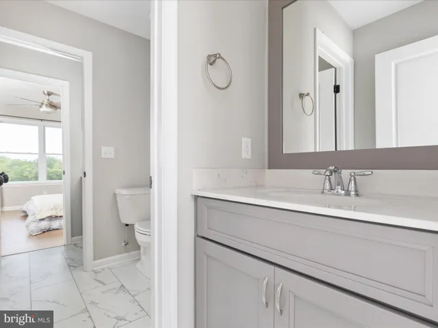 a view of room with window and ceiling fan