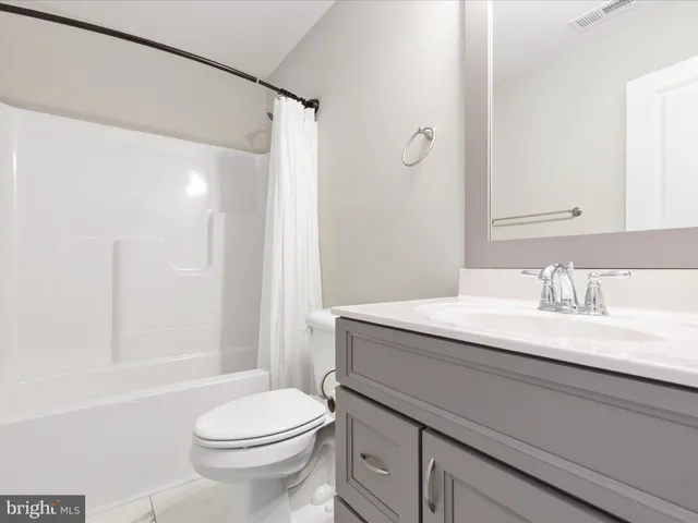 a view of an empty room with windows