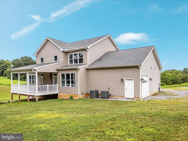a view of a garden with a building in the background