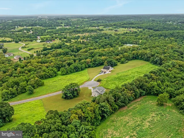 an aerial view of a house with a garden