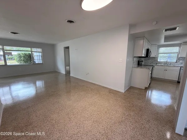 an empty room with windows