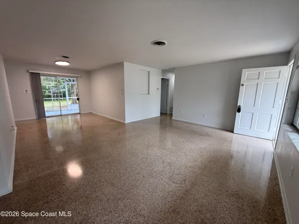 a spacious bathroom with a double vanity sink a mirror and a shower