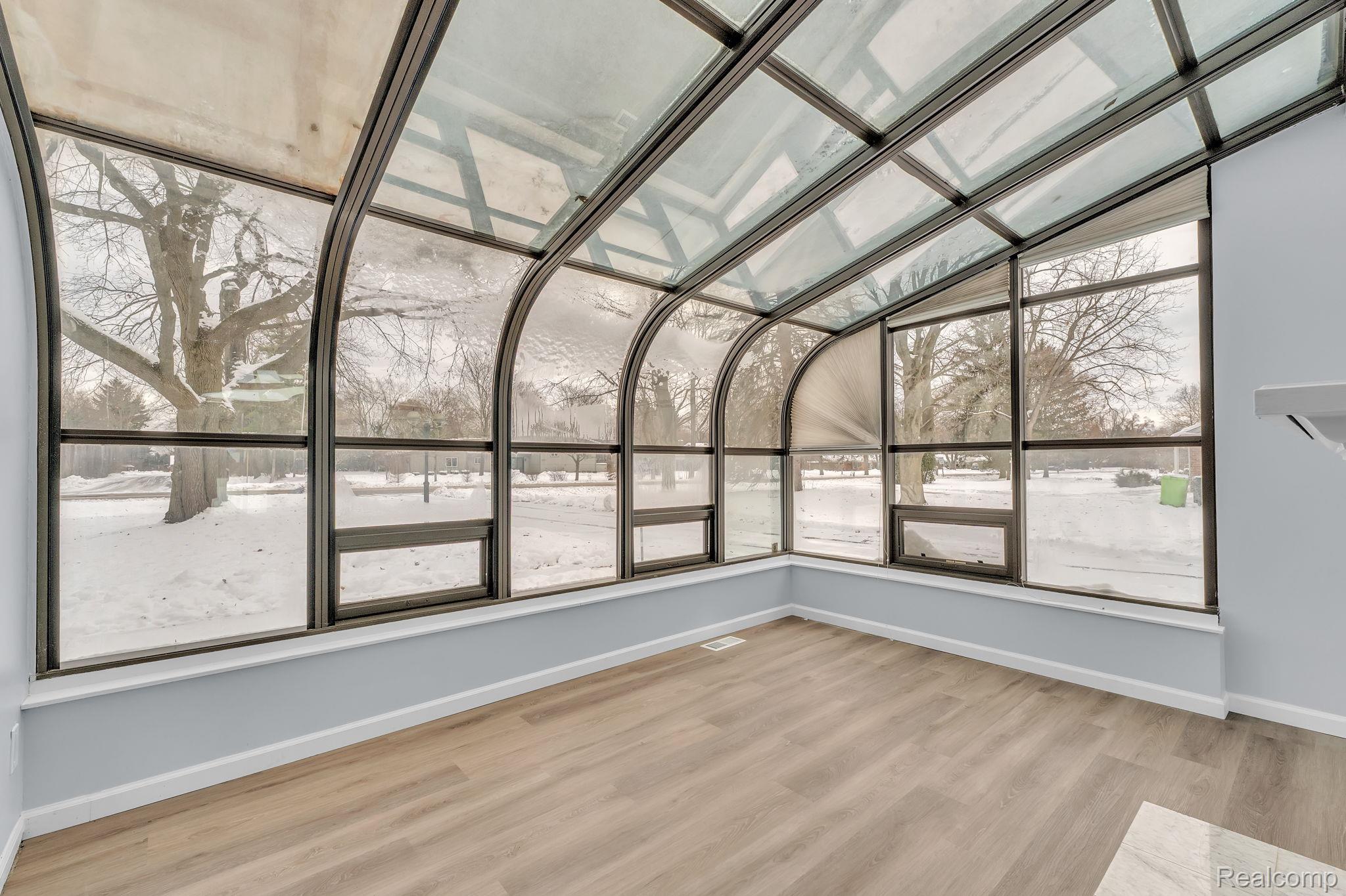6576 Inkster Road West Bloomfield, MI 48322 - Photo 26 of 62 Unfurnished sunroom with vaulted ceiling