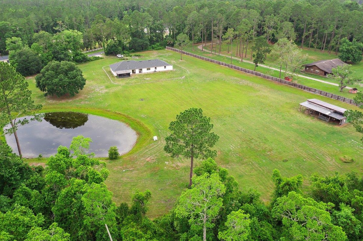 2670 Cabbage Hammock Road St. Augustine, FL 32092 - Photo 1 of 28 an aerial view of a residential houses with outdoor space and trees all around