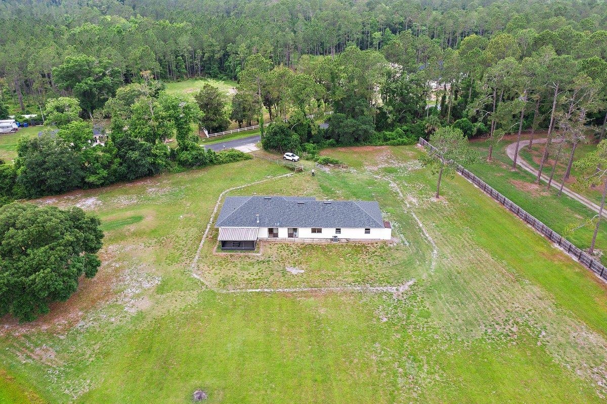 2670 Cabbage Hammock Road St. Augustine, FL 32092 - Photo 24 of 28 a view of a swimming pool with a yard