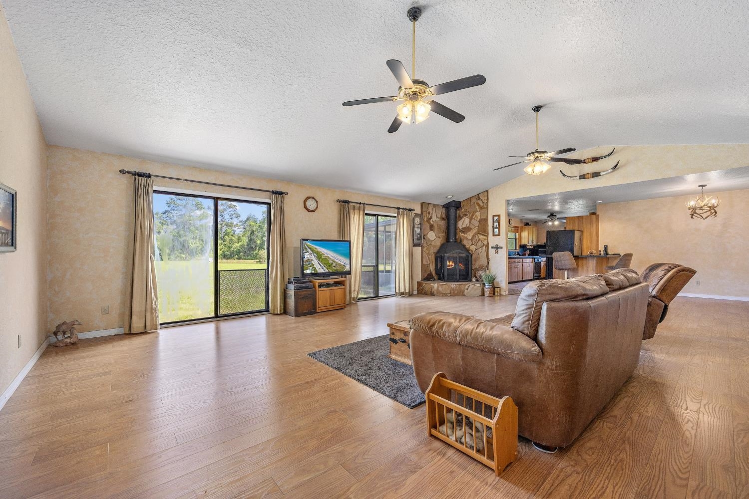 2670 Cabbage Hammock Road St. Augustine, FL 32092 - Photo 8 of 28 a living room with furniture gym equipment and a large window