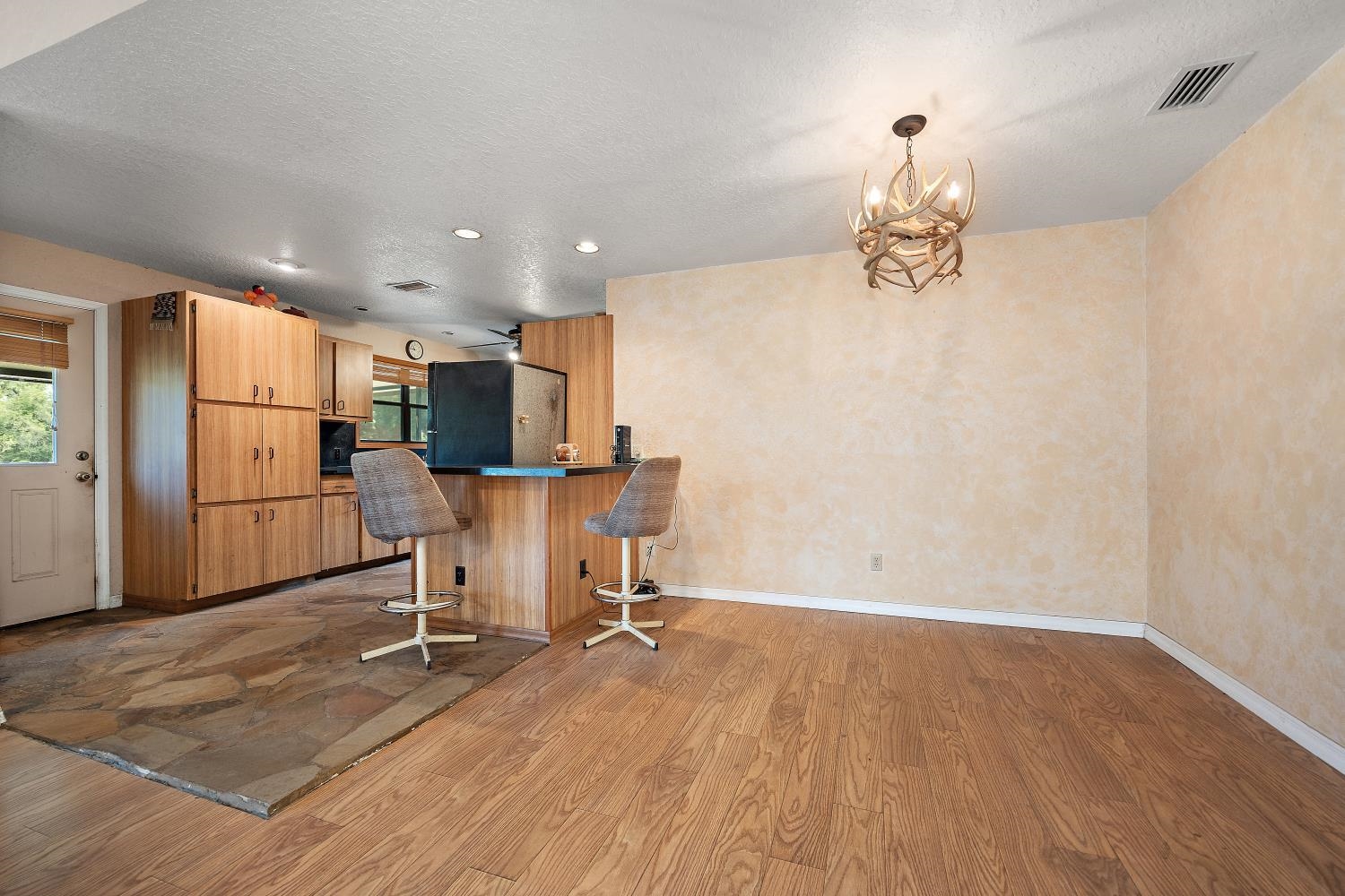 2670 Cabbage Hammock Road St. Augustine, FL 32092 - Photo 9 of 28 a view of a kitchen with refrigerator and wooden floor