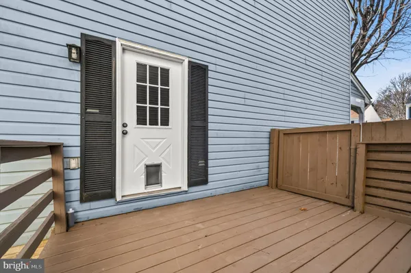 a view of a house with wooden deck