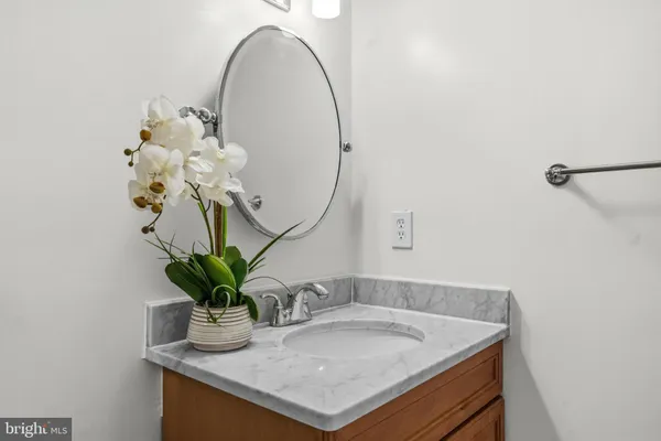 a bathroom with a sink a vanity and a mirror