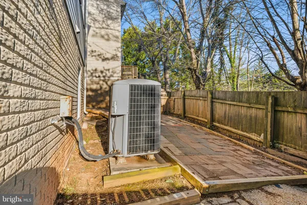 a view of a yard with wooden fence