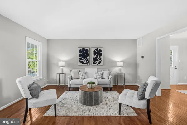 a living room with furniture and a table