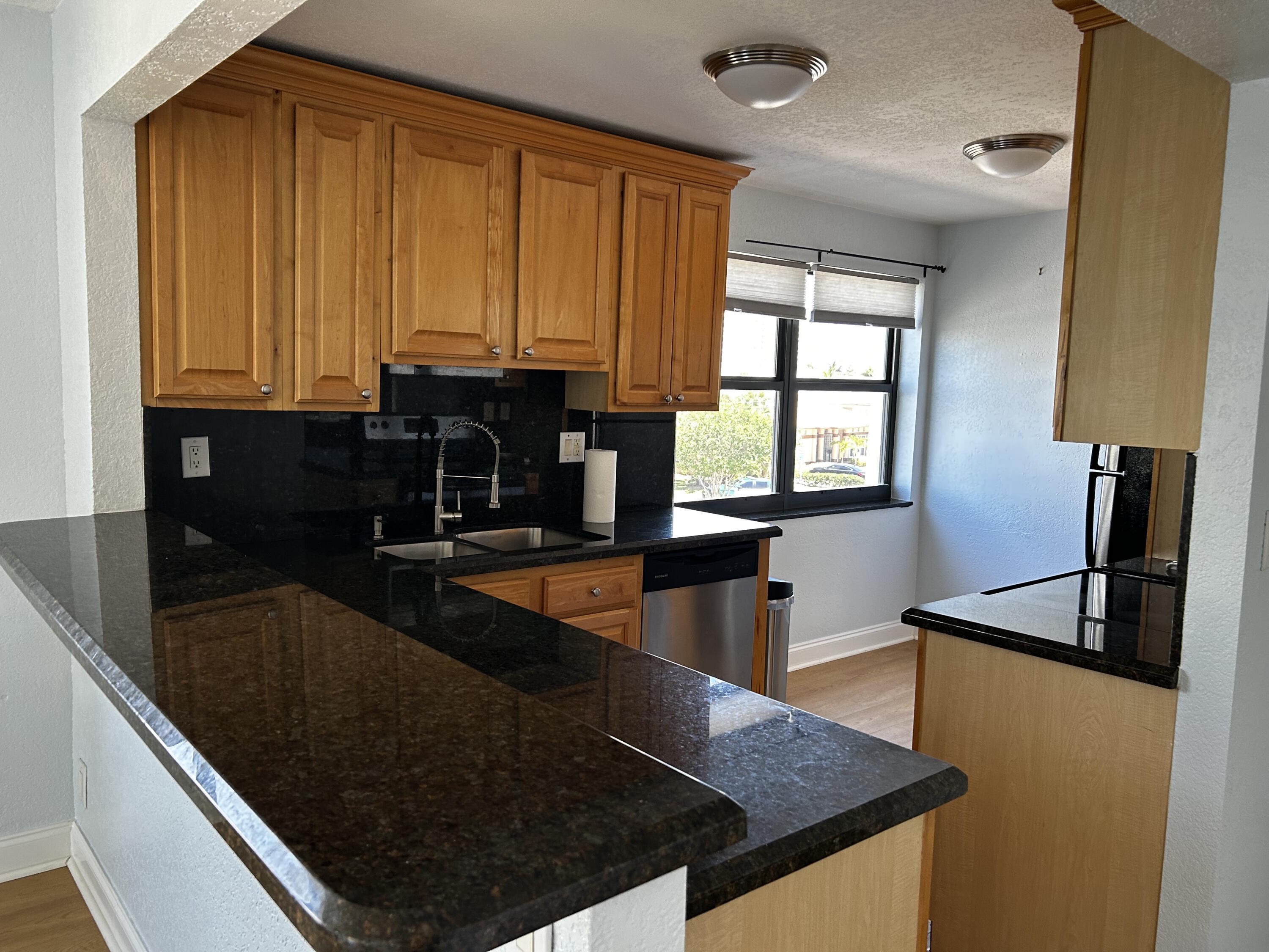 1401 North Riverside Drive, Unit 307 Pompano Beach, FL 33062 - Photo 20 of 29 Kitchen from hall