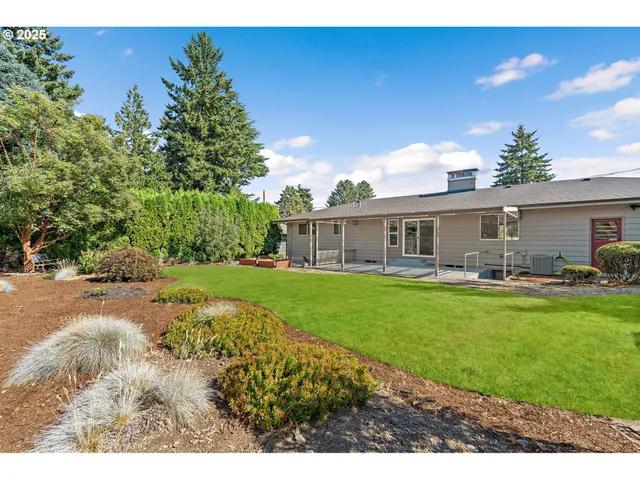 a front view of house with yard and outdoor seating