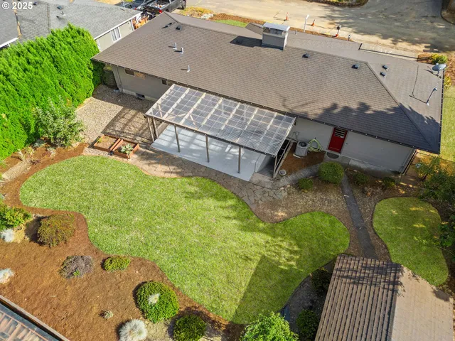 an aerial view of a house with swimming pool