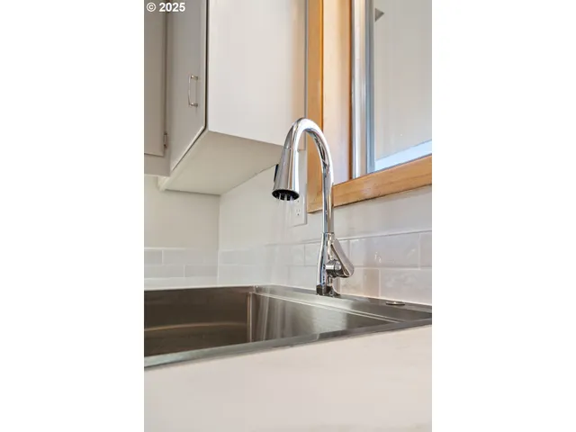 a close view of a sink and a mirror