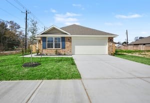 440 Bryan Street Angleton, TX 77515 - Photo 1 of 15 a front view of a house with a yard and potted plants