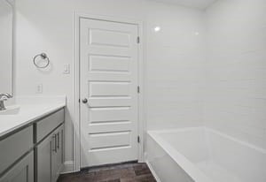 440 Bryan Street Angleton, TX 77515 - Photo 11 of 15 a bathroom with a bathtub and shower
